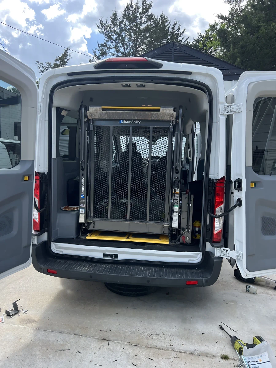 Rear of the wheelchair-accessible van showing the lift